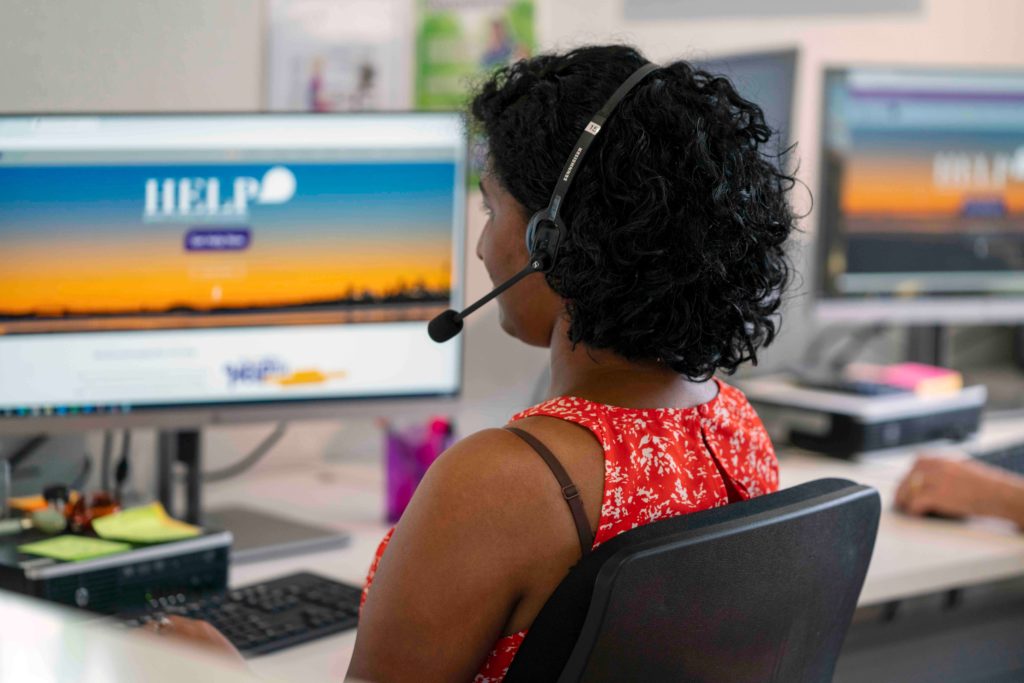 a woman answering a crisis phone support line