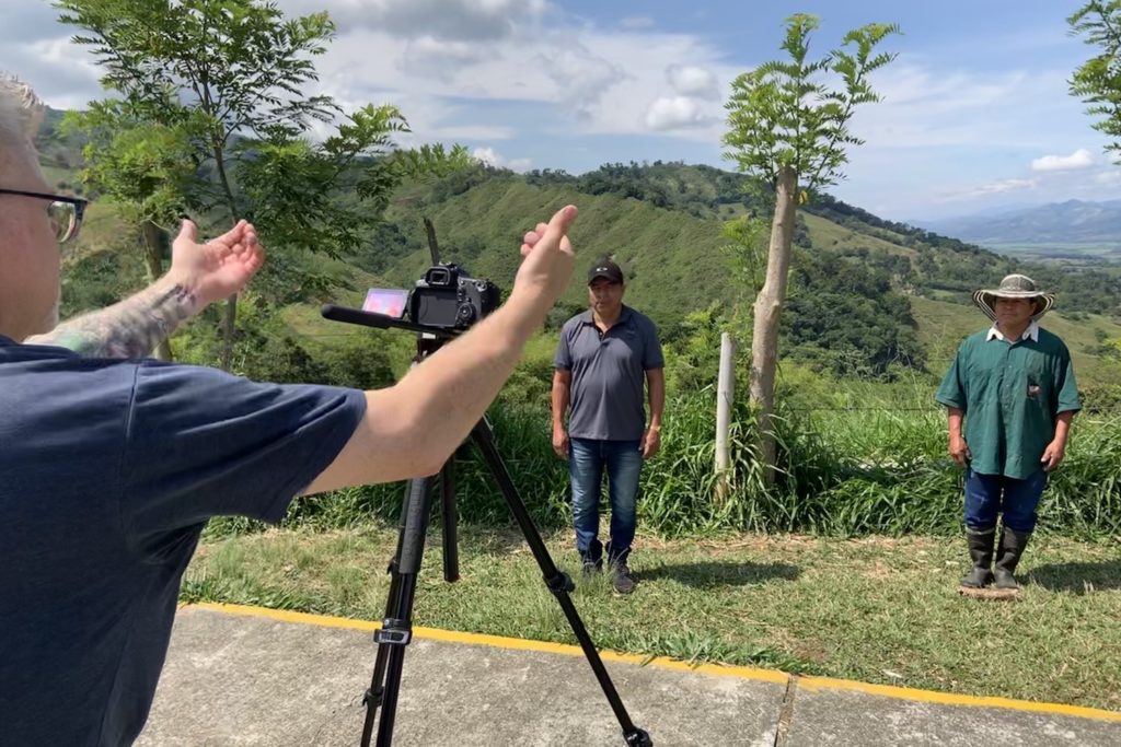 A camerman directing two subjects