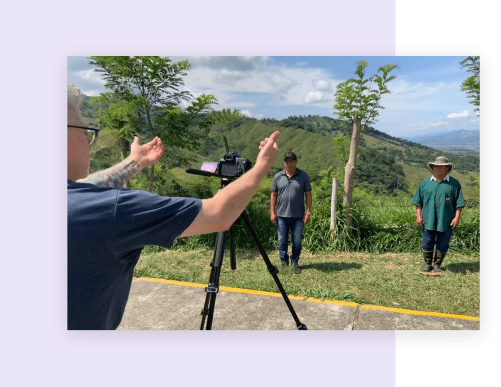 A camerman directing two subjects